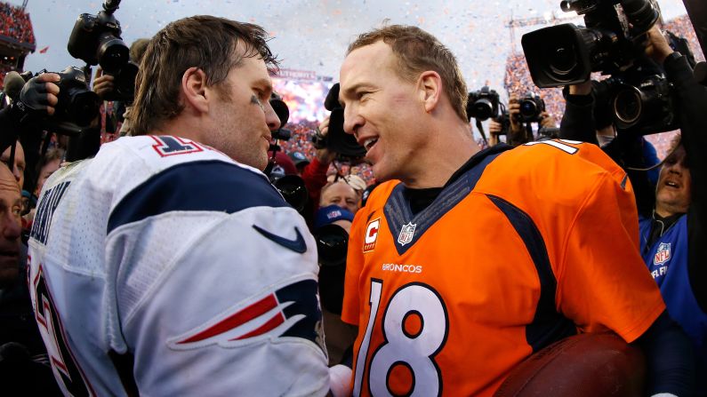 Peyton Manning, right, talks to fellow quarterback Tom Brady after the AFC Championship game in Denver on Sunday, January 24. Manning's Broncos defeated Brady's Patriots 20-18 to advance to the Super Bowl. It was the 17th time the two superstars have played against each other since 2001. Brady's teams have won 11 of those meetings, but Manning's teams have won three of the five playoff matchups.