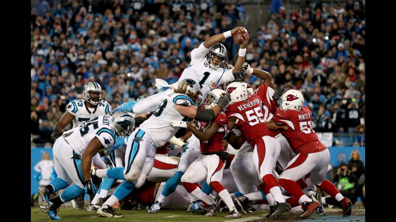 Carolina quarterback Cam Newton scores a touchdown against Arizona in the NFC Championship game on Sunday, January 24. Newton had four touchdowns -- two passing and two rushing -- to lead the Panthers to a 49-15 victory.