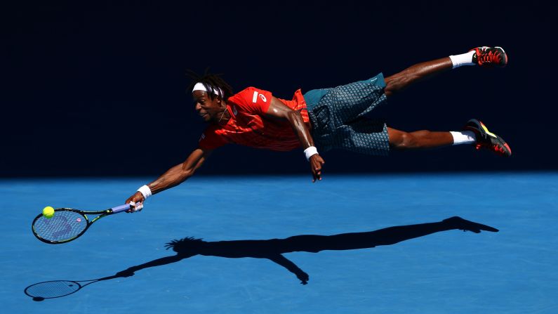 Gael Monfils dives for a forehand during his fourth-round match at the Australian Open on Monday, January 25. Monfils defeated Andrei Kuznetsov in four sets.