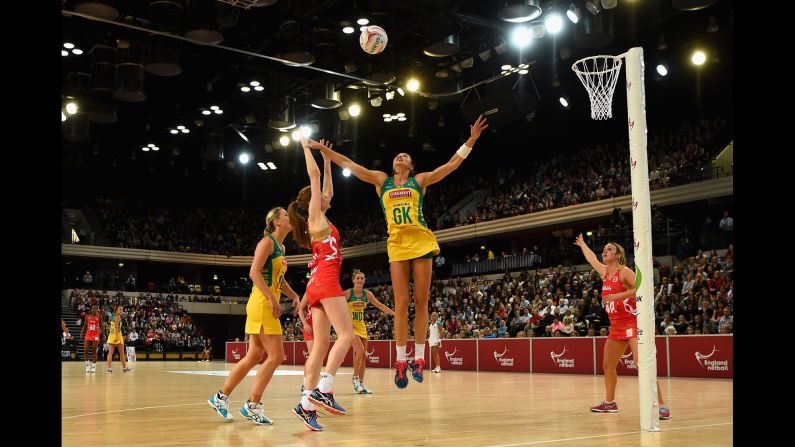 England's Helen Housby shoots over Australia's Sharni Layton during a netball game in London on Friday, January 22. Australia swept the three-game series.