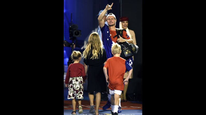 Lleyton Hewitt, trailed by his children, waves goodbye Thursday, January 21, after playing his final singles match at the Australian Open. Hewitt is retiring at the end of this season. During his career, the Australian won Wimbledon and the U.S. Open, and he was once the No. 1 player in the world.