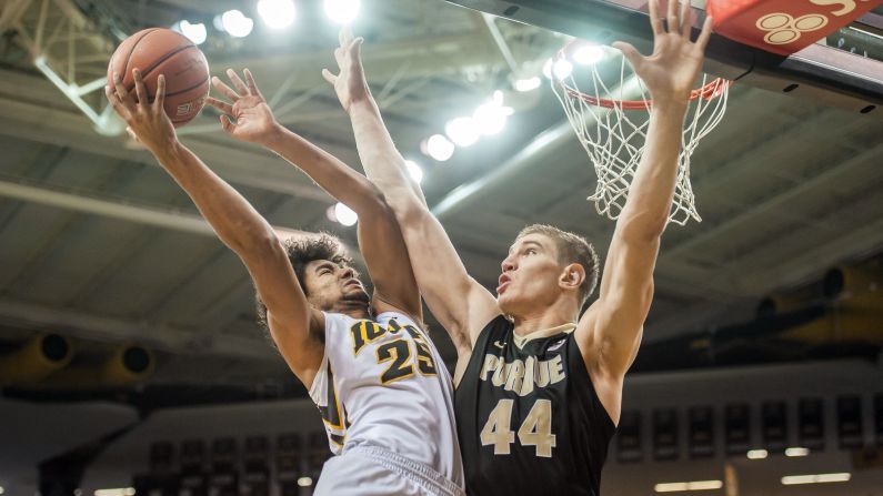 Iowa's Dom Uhl tries to score over Purdue's Isaac Haas during a Big Ten basketball game in Iowa City, Iowa, on Sunday, January 24.