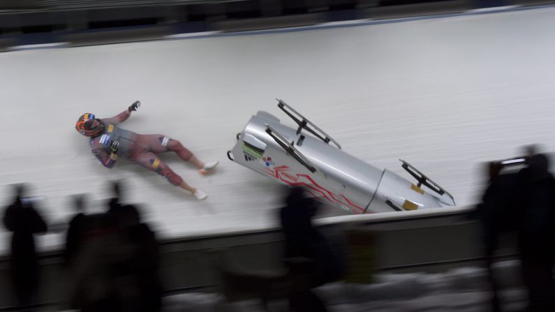 South Korea's Kim Keun-bo falls out of his bobsled during a World Cup crash in Whistler, British Columbia, on Saturday, January 23.