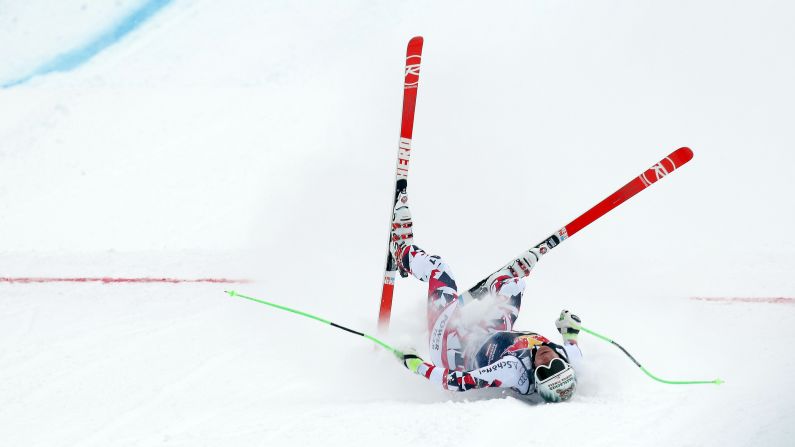 Austrian skier Otmar Striedinger lies on the ground after wiping out at the end of his downhill run in Kitzbuehel, Austria, on Saturday, January 23. 
