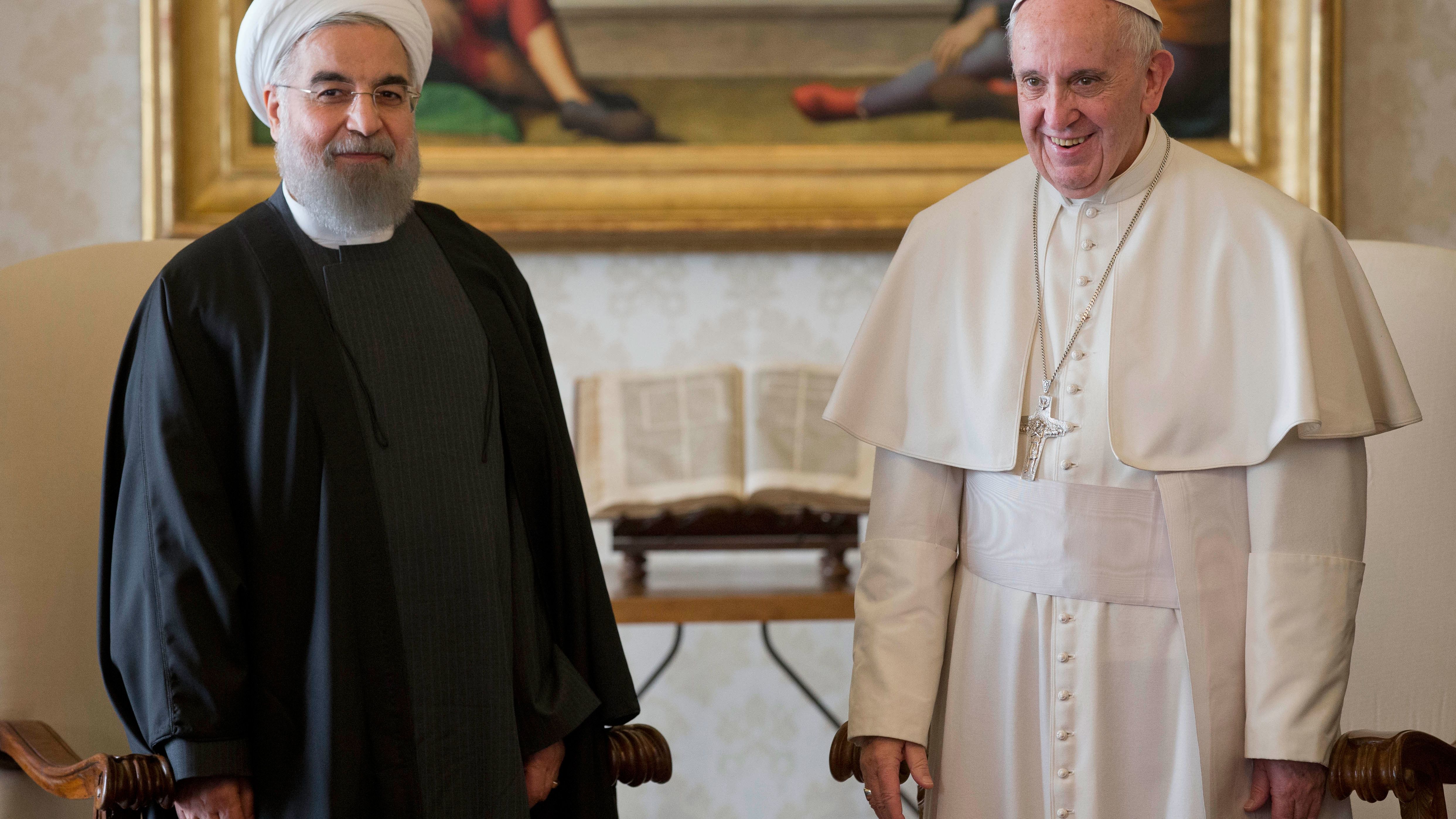 Pope Francis and Iranian President Hassan Rouhani pose for photographers at the Vatican on Tuesday, January 26.