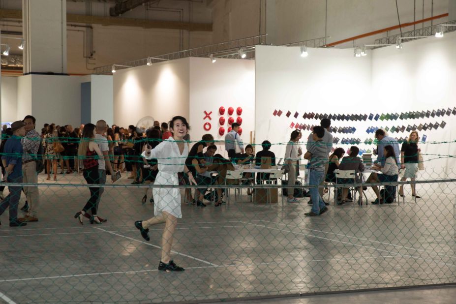 This interactive installation sees the badminton court's net replaced by a fence. 