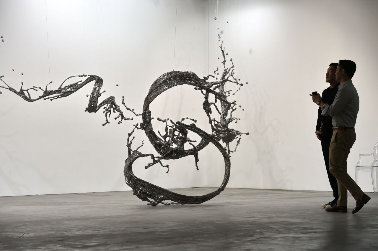 An art installation titled "Water Dripping - Splashing" is displayed at Art Stage Singapore in 2016.