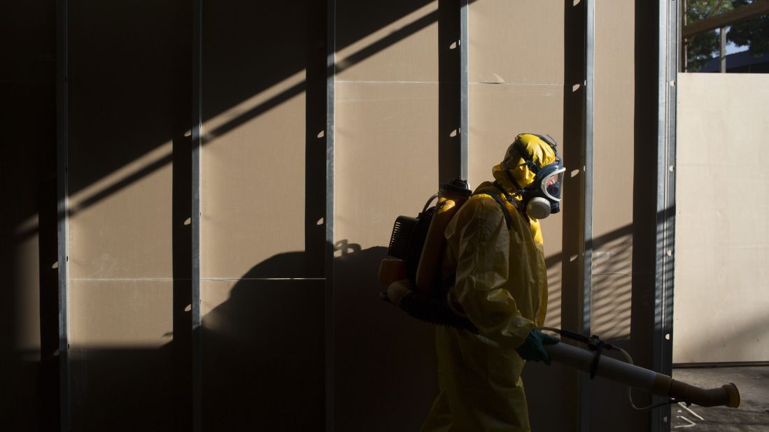 A health worker sprays insecticide under the bleachers of Rio de Janeiro's Sambadrome on Tuesday, January 26.