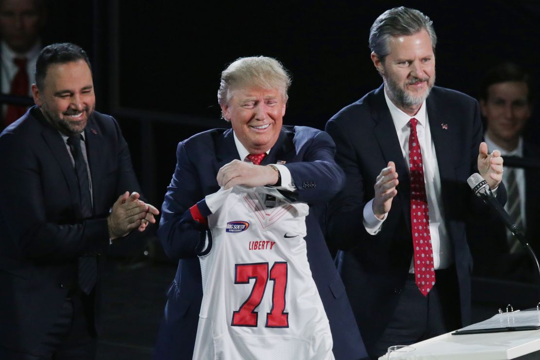 Liberty University President Jerry Falwell, Jr., right, presents Republican presidential candidate Donald Trump with a sports jersey after he delivered the convocation in the Vines Center at the university January 18, 2016 in Lynchburg, Virginia.