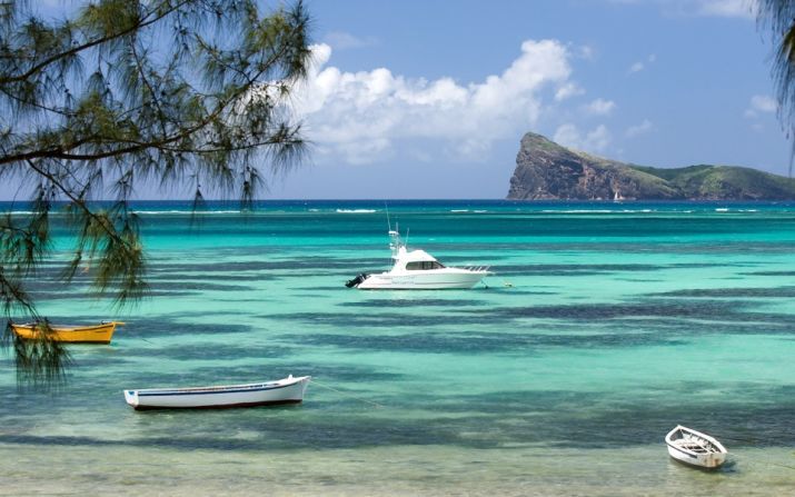 The island, known for its blue-green waters, draws in tourists and investors alike. 
