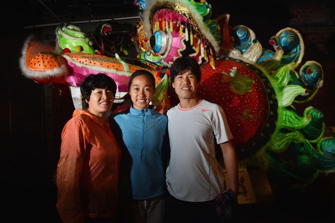 Zhang brought her mother Wang Feng Qin (left) and father Zhang Zhi Qiang (right) to Melbourne because she feared it could be her final top-level tournament.