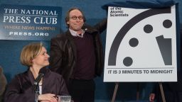 Lawrence Krauss, chair of the Bulletin of Atomic Scientists' Board of Sponsors unveils the "Doomsday Clock" showing that the world is now three minutes away from catastrophe during a press conference of the Bulletin of Atomic Scientists in Washington, DC, on January 26, 2016. / AFP / Nicholas Kamm        (Photo credit should read NICHOLAS KAMM/AFP/Getty Images)