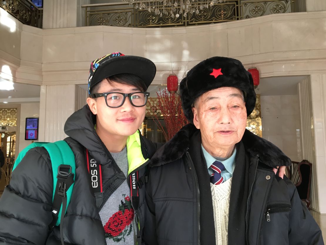 85-year-old Ding Bingcai, right, with grandson Ding Guoliang in a Beijing hotel on January 26, 2016. They are visiting Beijing from southern China's Fujian province to realize Bingcai's dream.