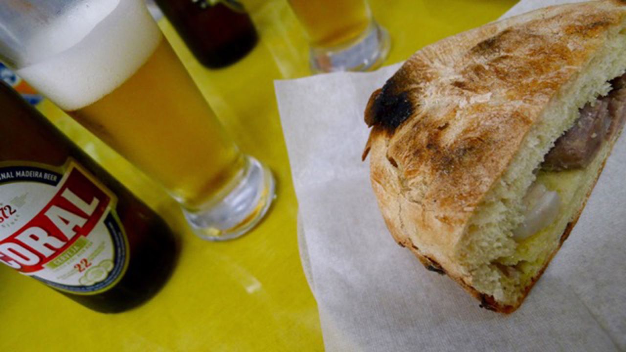 <strong>Bolo do caco: </strong>Next door to Funchal's market, the marble-fronted Snack Bar Coca Cola serves a legendary sandwich that squeezes scabbard fish marinated with onion and vinegar into a bolo do caco -- a typical Madeiran flat loaf.
