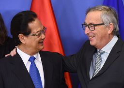 Dung, pictured here meeting with European Commission President Jean-Claude Juncker in December, is seen as more pro-West than his rival. 