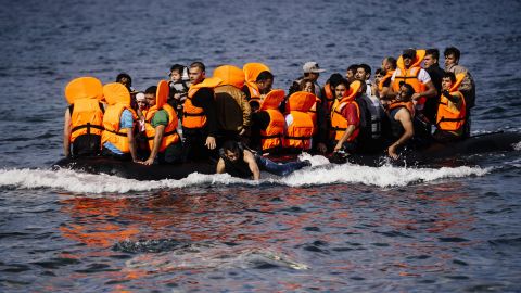 Migrants arrive on the Greek island of Lesbos after crossing the Aegean sea from Turkey October 18, 2015.