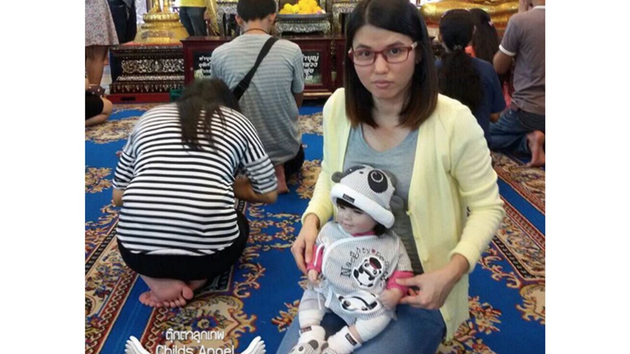 A Luk Thep doll is treated as a real child by its adopted "parent" and can cost as much as $362.