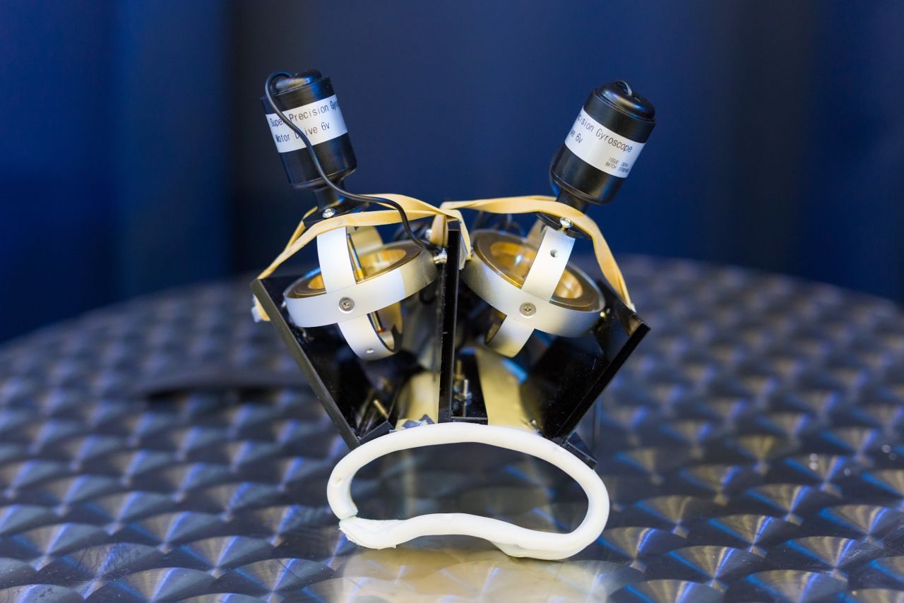 The glove utilizes spinning disks (gyroscopes) to steady the hand. They spin at around 20,000 rpm -- faster than a jet turbine -- to counter any trembling in the hand. Pictured, the glove prototype.