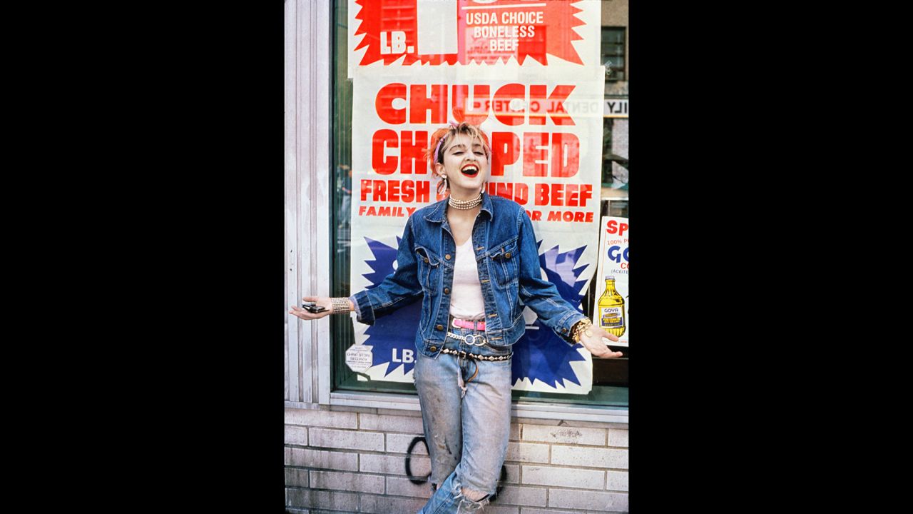 Madonna stops in front of a bodega on the Lower East Side.