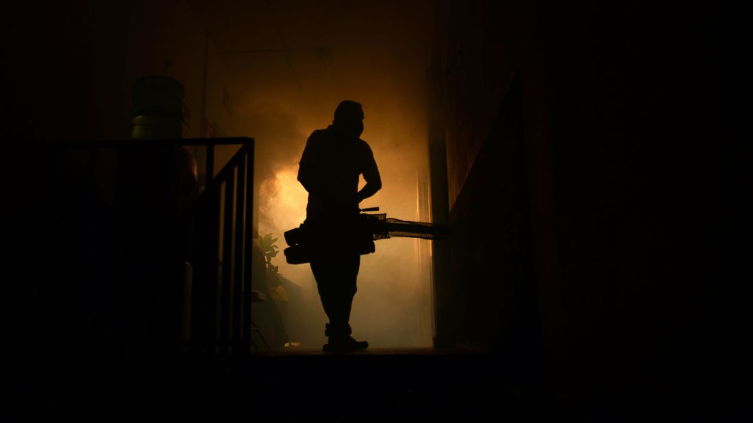 A health ministry employee fumigates a home in Soyapango, El Salvador, on January 27.