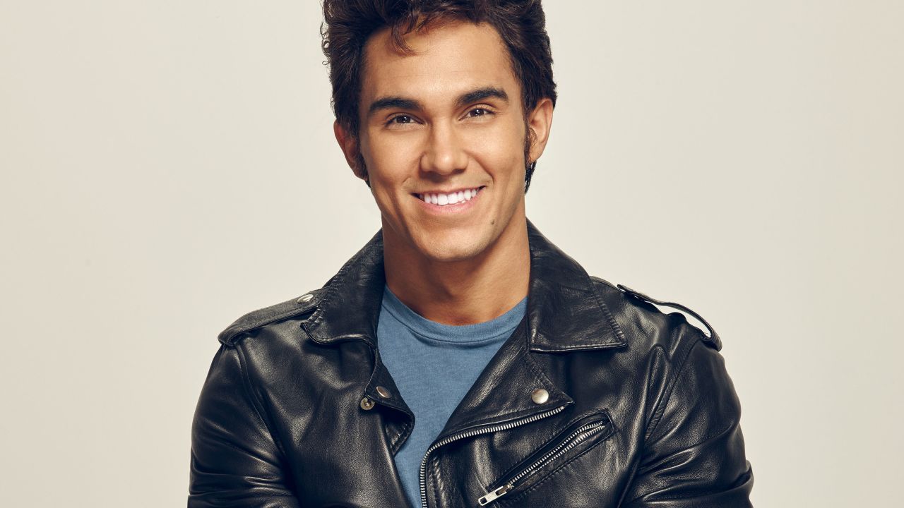 Carlos PenaVega, who plays Kenickie in "Grease: Live," is part of the group Big Time Rush (and was on the TV show of the same name) and hosted Nickelodeon's game show "Webheads."