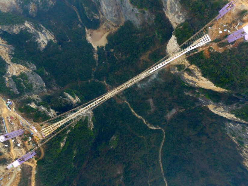 The bridge stretches over two dramatic cliffs in Hunan's Zhangjiajie National Forest Park. 