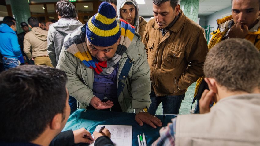 Refugee's register their names as they arrive to Stockholm central mosque on October 15, 2015 after many hours bus journey from the southern city of Malmo. Since September, Islamic Relief Sweden welcomes newly arrived refugees at the Stockholm central mosque for one or two nights before they seek asylum in Sweden or travel further to Norway or Finland. AFP PHOTO / JONATHAN NACKSTRAND        (Photo credit should read JONATHAN NACKSTRAND/AFP/Getty Images)