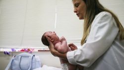 RECIFE, BRAZIL - JANUARY 27:  Dr. Vanessa Van Der Linden, the neuro-pediatrician who first recognized the microcephaly crisis in Brazil, examines a 2-month-old baby with microcephaly on January 27, 2016 in Recife, Brazil.  The baby's mother was diagnosed with having the Zika virus during her pregnancy. In the last four months, authorities have recorded close to 4,000 cases in Brazil in which the mosquito-borne Zika virus may have led to microcephaly in infants. The ailment results in an abnormally small head in newborns and is associated with various disorders including decreased brain development. According to the World Health Organization (WHO), the Zika virus outbreak is likely to spread throughout nearly all the Americas. At least twelve cases in the United States have now been confirmed by the CDC.  (Photo by Mario Tama/Getty Images)