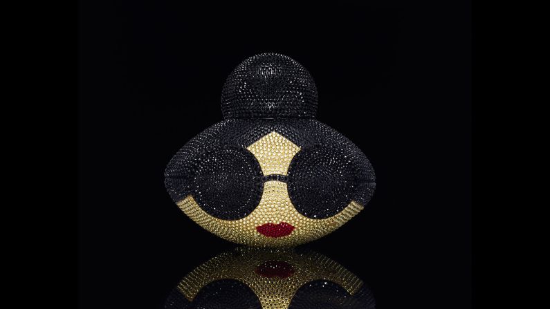 This ball features the brand's signature "Stace Face" icon and is covered in Swarovski crystals. 