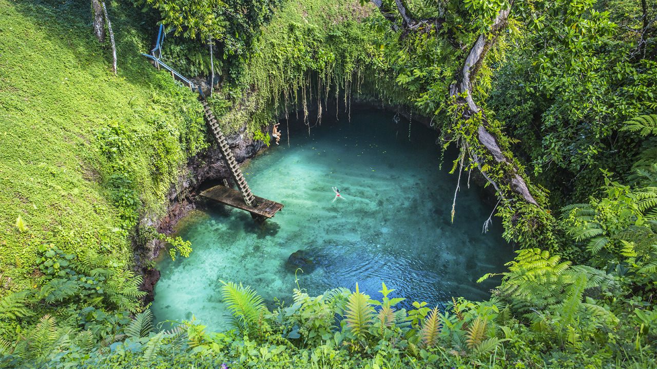 To Sua Ocean Trench is a beautiful swimming hole on the southern coast of Upolu, one of Samoa's bigger islands. The bright blue waters are fed by a lava tube that connects it to the Pacific. 