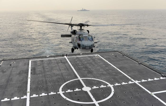 The helicopter lands on the deck of a Panshi supply ship during the drill near Kaohsiung port on January 27.