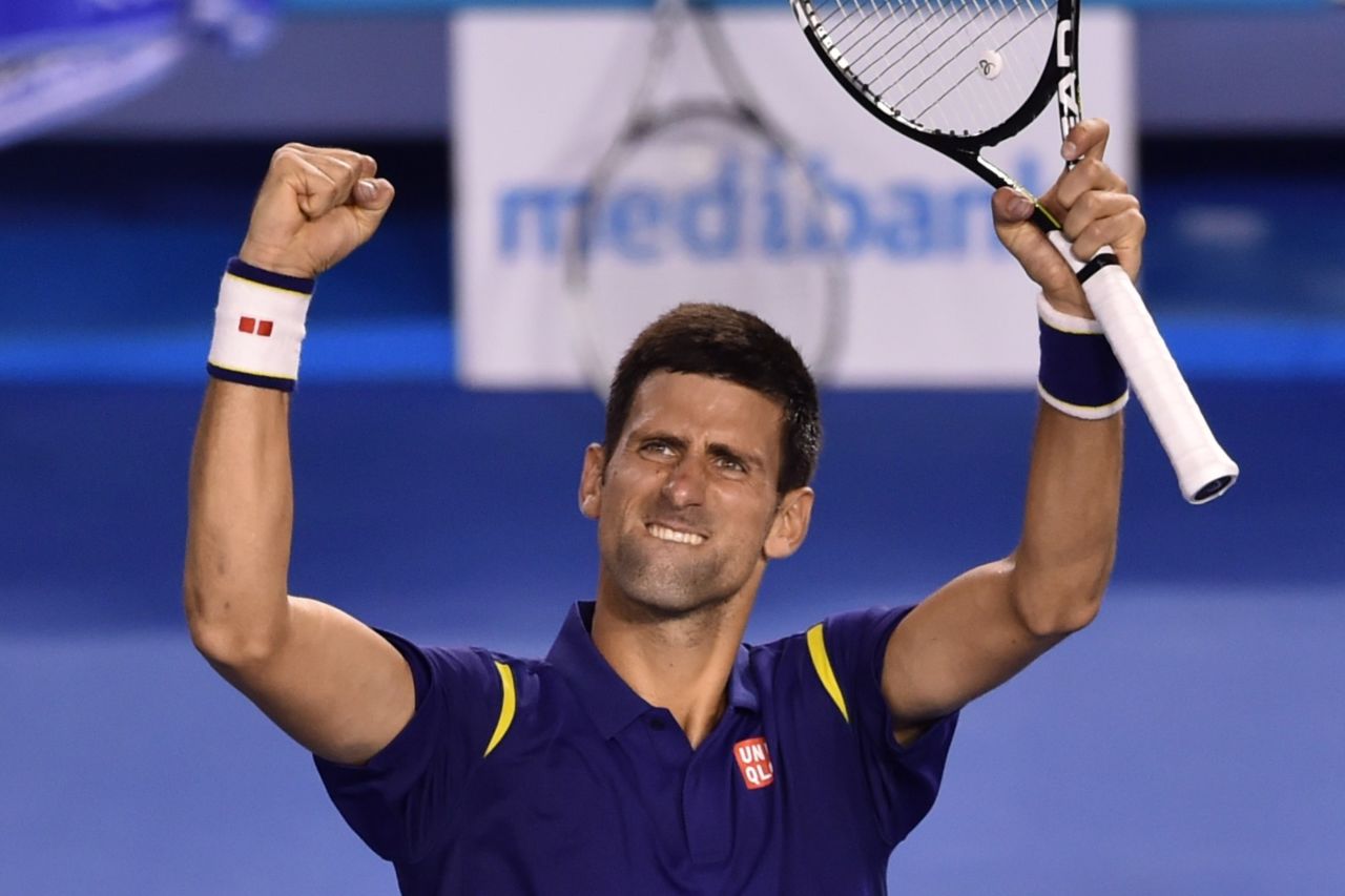 Novak Djokovic celebrates after beating Roger Federer in the Australian Open semifinals. 