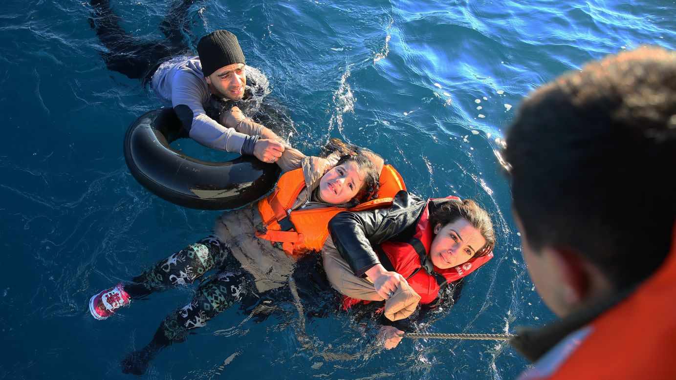 The Turkish coast guard helps refugees after their boat toppled en route to Greece on Friday, January 22. <a href="http://www.cnn.com/2015/09/03/world/gallery/europes-refugee-crisis/index.html" target="_blank">More than 1 million refugees and migrants</a> escaped to Europe in 2015, according to the U.N. refugee agency.
