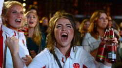 England fans react as they watch the England v Wales rugby union game on a giant television screen at a fanzone in Cardiff, Wales, on September 26, 2015, during the 2015 Rugby World Cup. AFP PHOTO / GABRIEL BOUYS        (Photo credit should read GABRIEL BOUYS/AFP/Getty Images)
