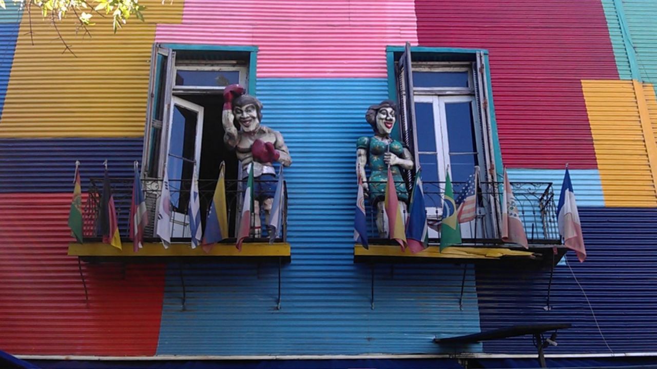 Nothing is subtle in La Boca. Brightly painted walls, caricature figurines and gaudy graffiti vie for attention.