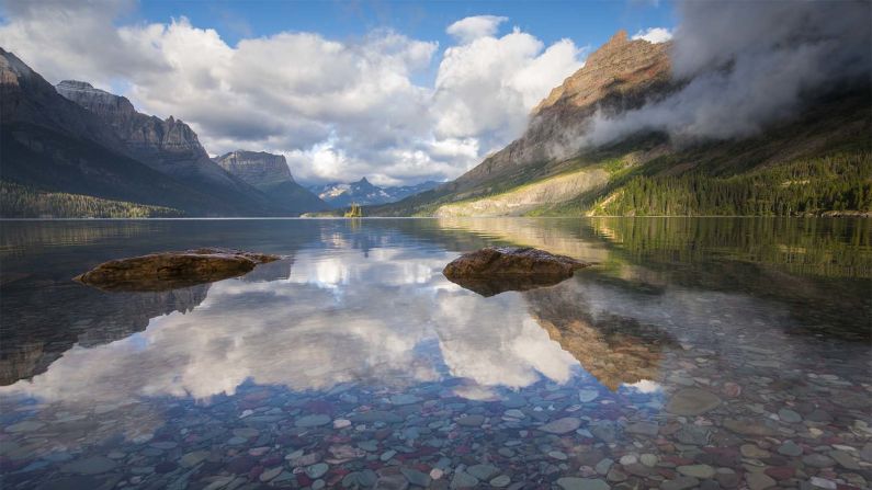 In Montana's Glacier National Park, reflections in St. Mary's Lake capture the expansiveness of the landscapes protected by the National Park Service.