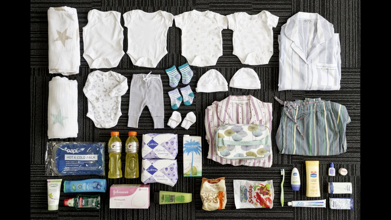 Katy Shaw's bag includes: toiletries, snacks, diapers, hat, socks, mittens, clothes and swaddles for the baby, clothes for the mom, nightgowns, maternity underwear, maternity pads, nursing pads and massage oils.