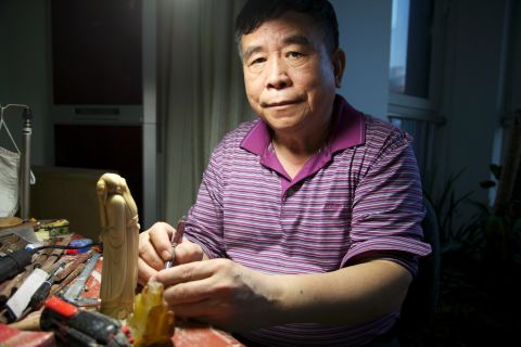 Li Chunke started carving ivory in 1964 when the number of elephants in Africa was still on the rise. But changing attitudes towards ivory are threatening carvers' livelihoods and an art form that has been practiced for generations.  