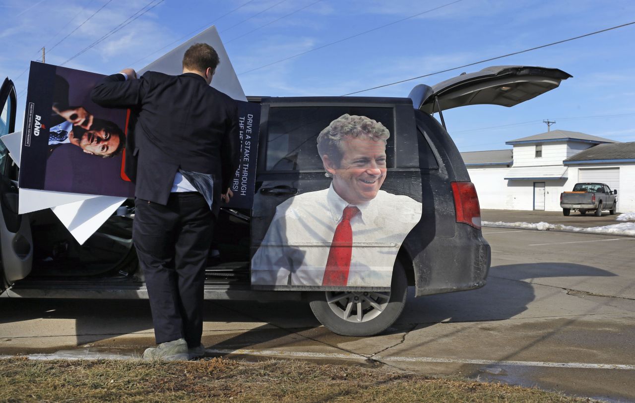 Jonathan Van Norman, a field staffer for U.S. Sen. Rand Paul, loads campaign material into a van after the Republican presidential candidate attended a town-hall meeting in Knoxville, Iowa, on Friday, January 29.