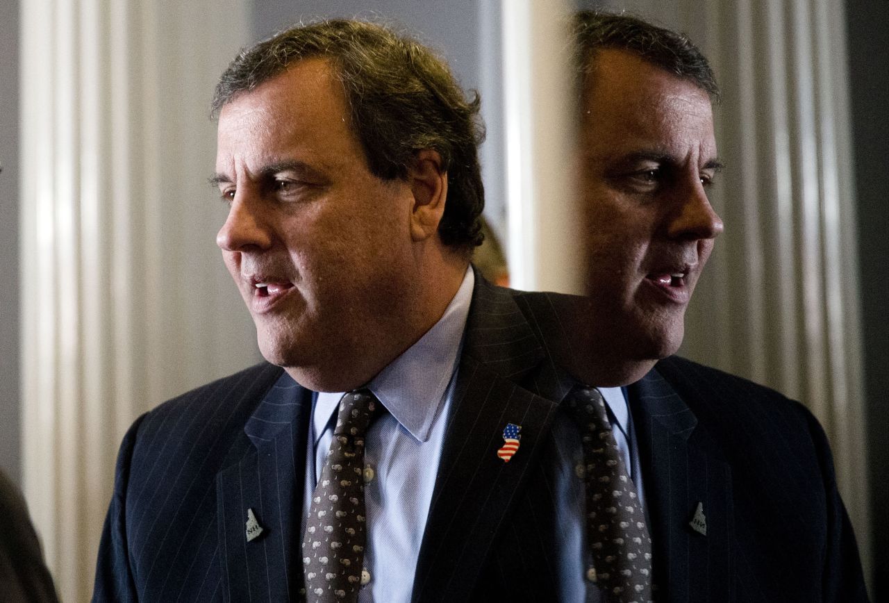 New Jersey Gov. Chris Christie, a Republican presidential candidate, talks with a supporter before a news conference in Concord, New Hampshire, on Monday, January 25.