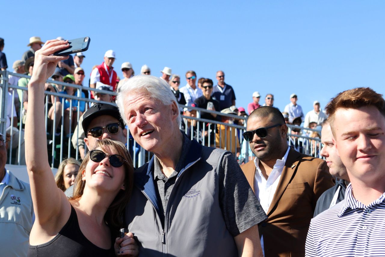 Former U.S. President Bill Clinton poses for a selfie during a pro golf event in La Quinta, California, on Sunday, January 24.