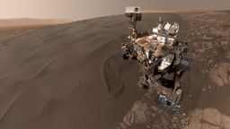 NASA's Curiosity Mars rover took this selfie while sitting at "Namib Dune." The rover is has been scooping up sand from the dune to analyze. The photo combines 57 images taken on January 19, 2016 during the rover's 1,228th Martian day, or sol. The photos were taken with the Mars Hand Lens Imager at the end of the rover's robotic arm.