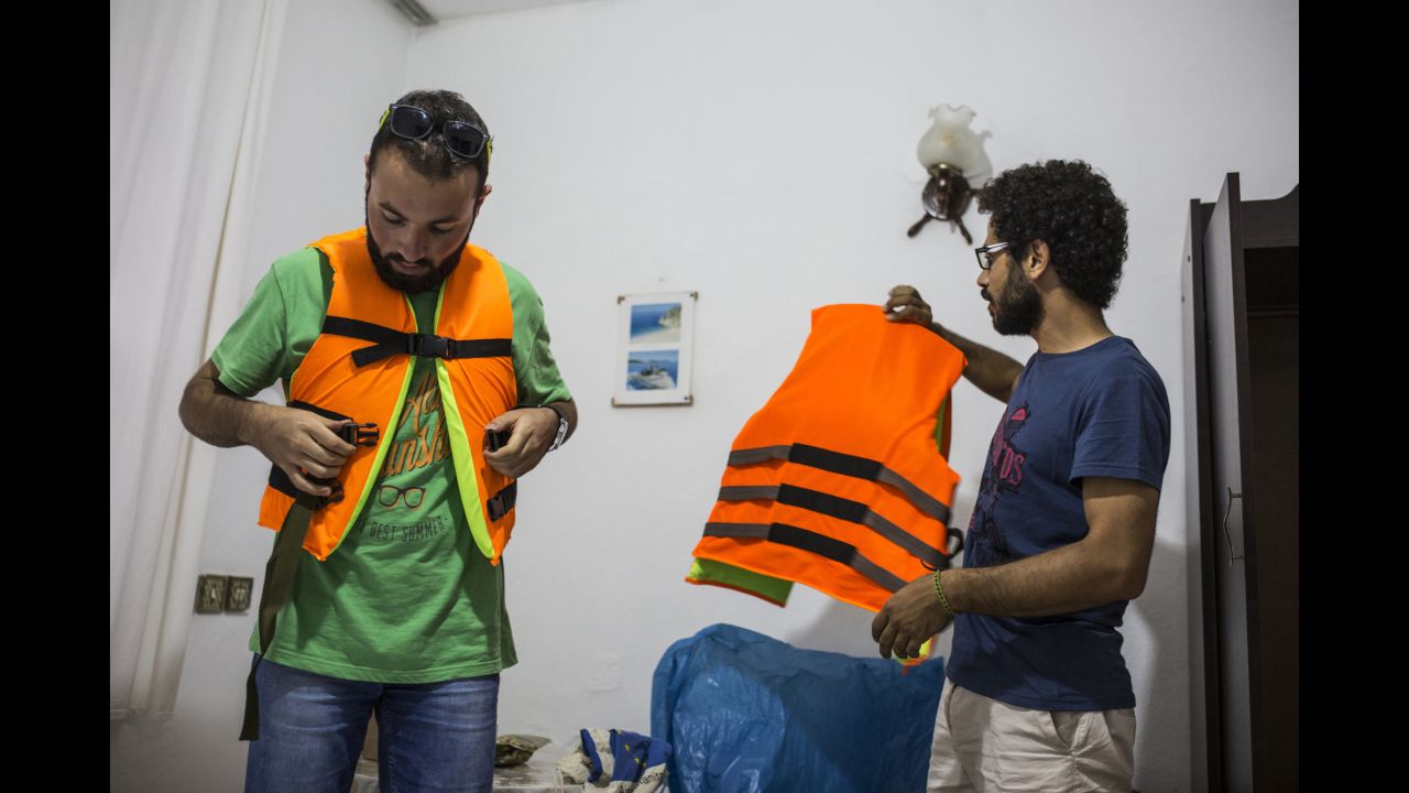 Somar and a friend, Ali, buy life jackets in Turkey before crossing the sea into Greece. The family paid a smuggler 1,000 euros each ($1,100 U.S.) to get them into the country.