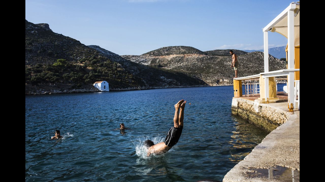 Somar and friends swim on Kastellorizo island, a famous tourist destination, two days after landing on Greece soil.