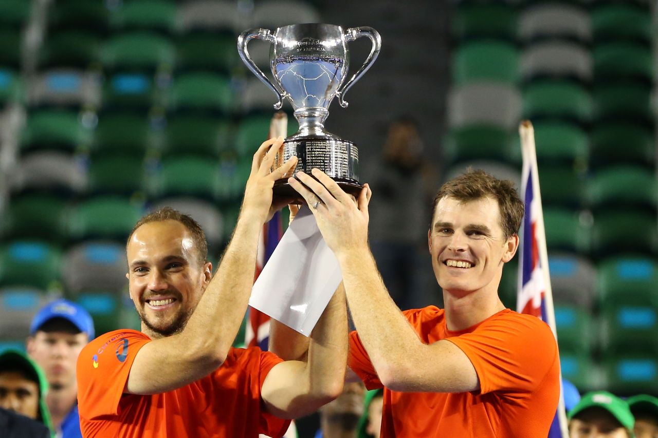 Jamie Murray of Britain (right) and Bruno Soares of Brazil lift the men's doubles trophy after beating Daniel Nestor of Canada and Radek Stepanek of Czech Republic in the final.