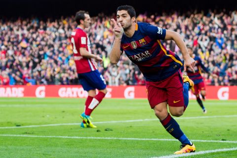 Luis Suarez celebrates after scoring his team's second and decisive goal in Barcelona's 2-1 victory over Atletico.