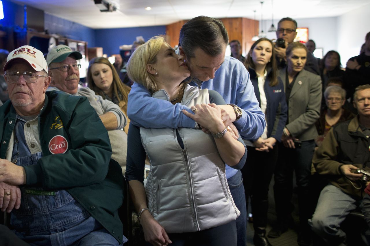 Heidi Cruz whispers to her husband, U.S. Sen. Ted Cruz, as they are introduced at a campaign event in Ringsted, Iowa, on Friday, January 29. Cruz is seeking the Republican Party's nomination for President.
