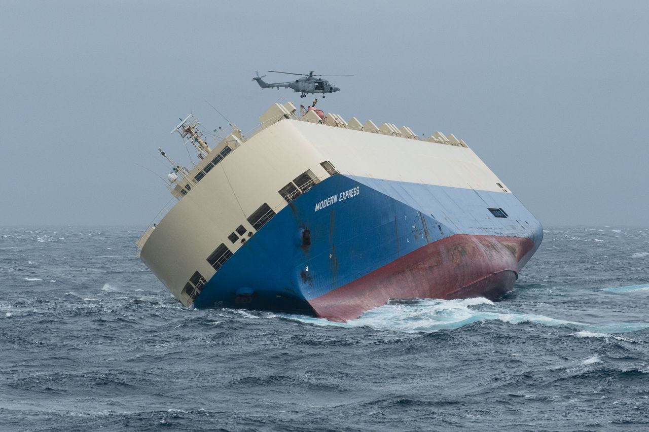 The now-abandoned cargo ship Modern Express -- listing nearly 90 degrees -- drifts Saturday, January 30, in heavy seas in the Atlantic some 200 kilometers (125 miles) off the coast of France. All 22 crew members were safely airlifted from the ship by Spanish rescue helicopters after a distress signal was sent on Tuesday, January 26. Plans are for a salvage operation to try to tow the ship, which was carrying a load of wood from Gabon on Africa's west coast to the French port of Le Havre, to port once seas calm.