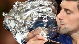 Serbia's Novak Djokovic kisses The Norman Brookes Challenge Cup after his victory during the men's singles final against Britain's Andy Murray on day 14 of the 2016 Australian Open tennis tournament in Melbourne on January 31, 2016. AFP PHOTO / PETER PARKS -- IMAGE RESTRICTED TO EDITORIAL USE - STRICTLY NO COMMERCIAL USE / AFP / PETER PARKS        (Photo credit should read PETER PARKS/AFP/Getty Images)