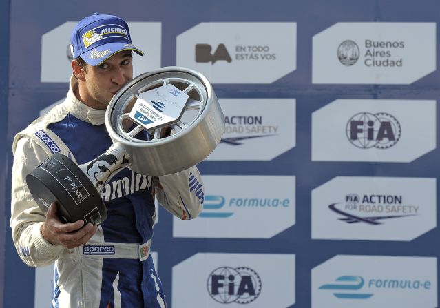 Team Aguri's Portuguese driver Antonio Felix da Costa gets passionate with the trophy after winning the inaugural race in 2015. 
